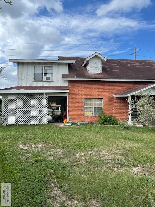 103 Alan A Dale St, Brownsville, TX 78521 - view of front of home with a front yard and brick siding