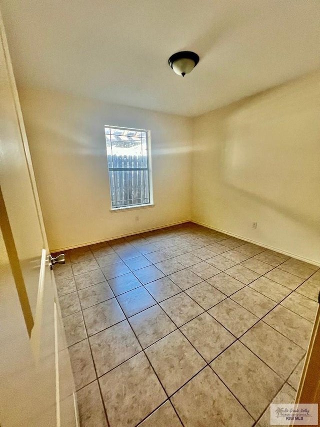 view of tiled spare room