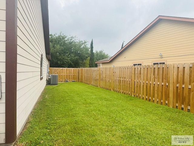 view of yard featuring cooling unit and a fenced backyard