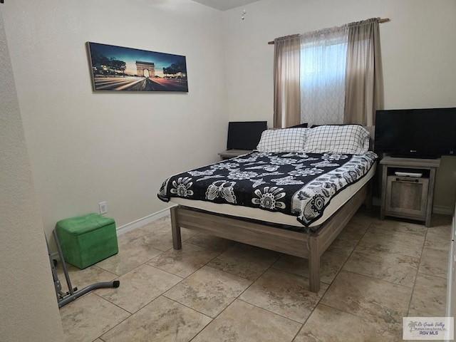 bedroom featuring baseboards