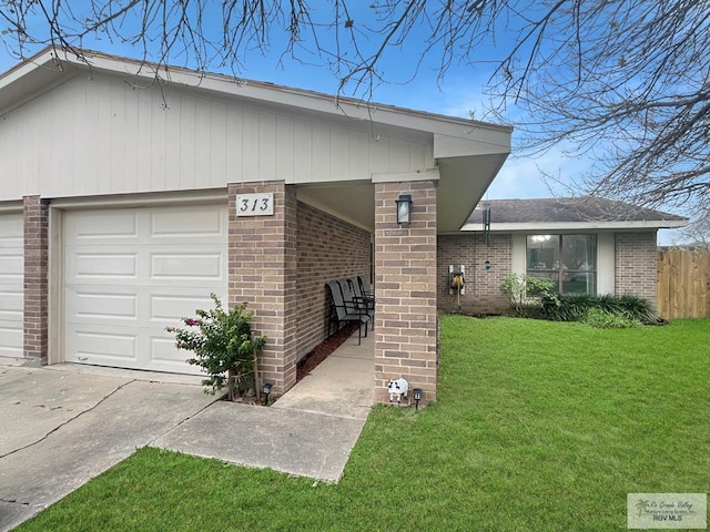 exterior space featuring a garage and a front yard