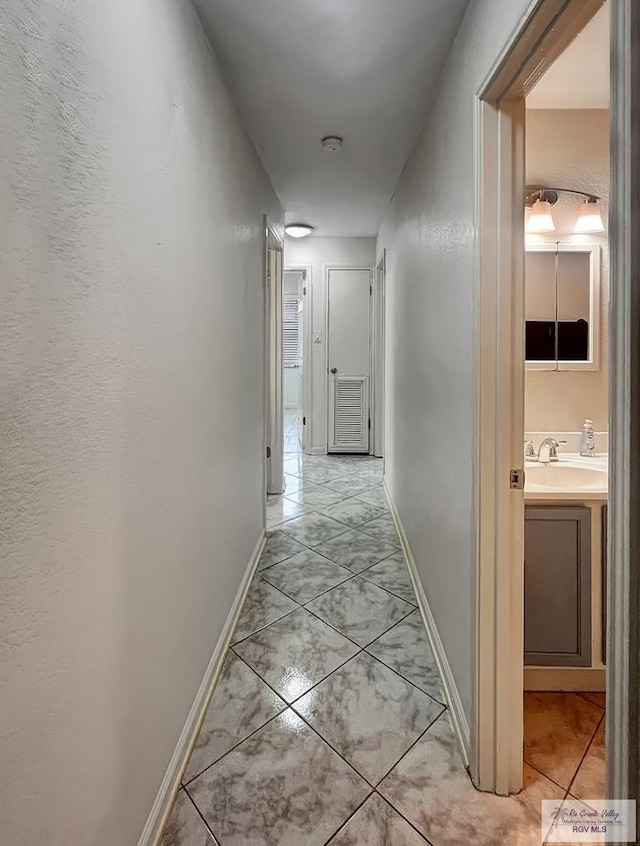 hallway featuring sink