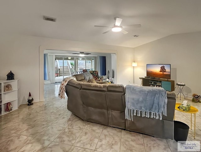 living room featuring lofted ceiling and ceiling fan