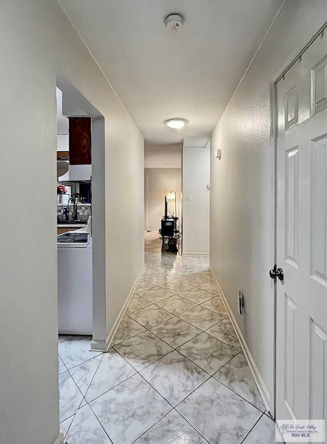 corridor featuring washer / clothes dryer