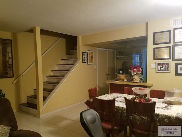 2 Palmetto Ct, Brownsville, TX 78521 - dining space featuring stairway, tile patterned floors, and baseboards