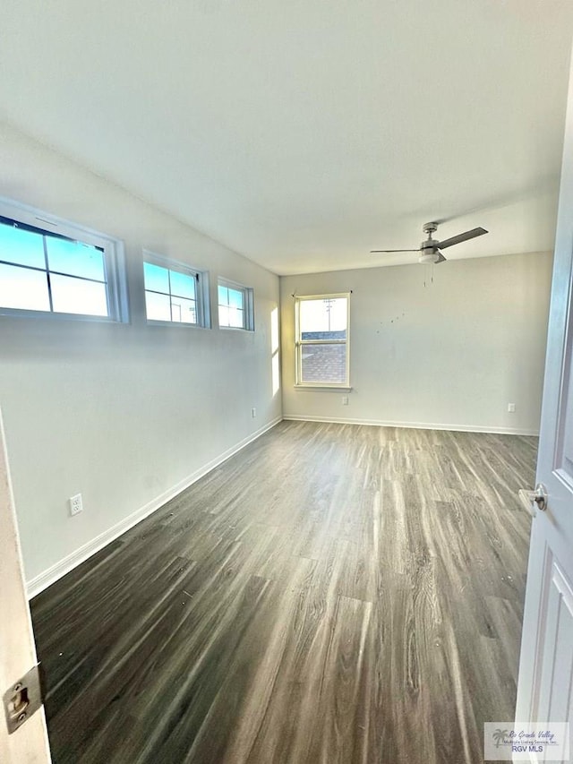 empty room featuring ceiling fan and hardwood / wood-style floors