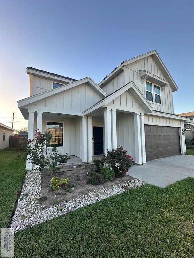 view of front facade featuring a front yard and a garage