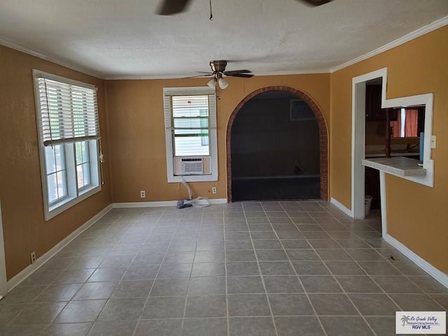 unfurnished living room featuring a wealth of natural light, tile patterned flooring, cooling unit, and ceiling fan