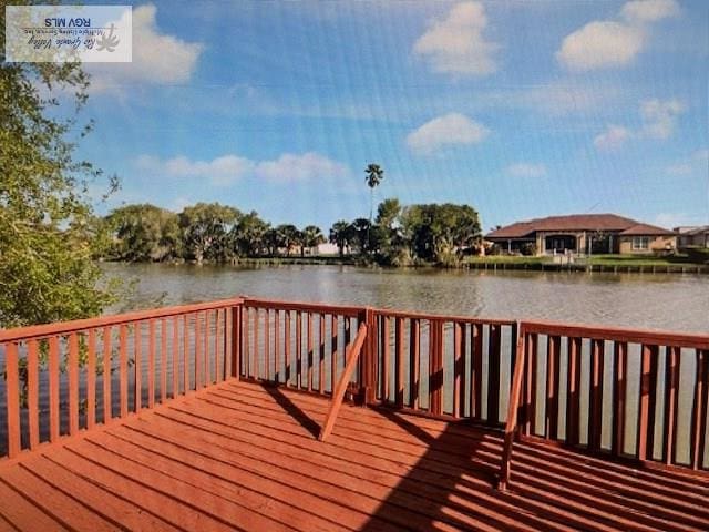 71 Cortez Ave, Rancho Viejo, TX 78575 - dock area with a deck with water view