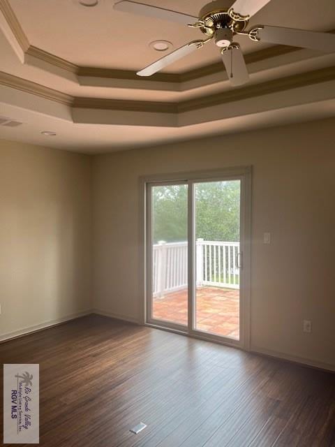71 Cortez Ave, Rancho Viejo, TX 78575 - spare room with a tray ceiling, ceiling fan, wood finished floors, and ornamental molding