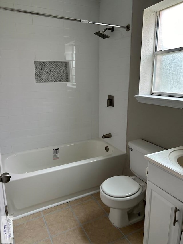 bathroom with toilet, tub / shower combination, vanity, and tile patterned floors