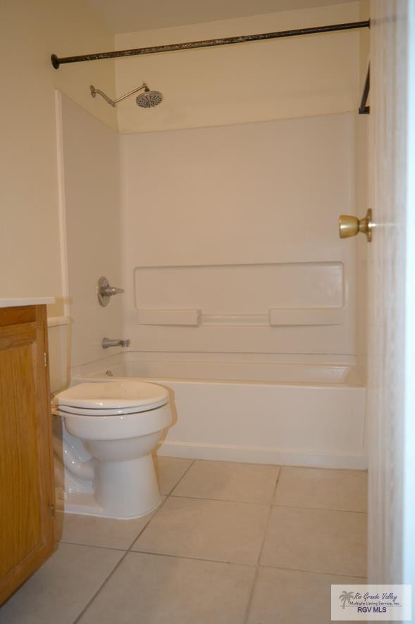 full bathroom featuring shower / tub combination, tile patterned flooring, vanity, and toilet