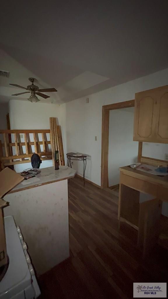 kitchen featuring dark wood-type flooring and ceiling fan