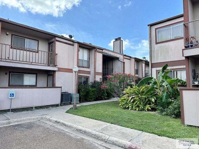 view of property featuring central AC unit