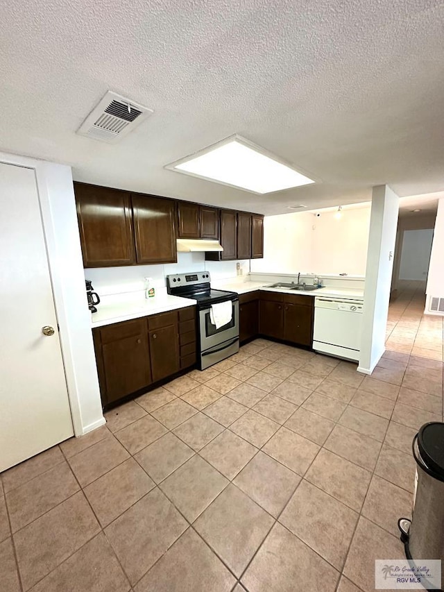 kitchen featuring dishwasher, dark brown cabinets, electric stove, and a textured ceiling