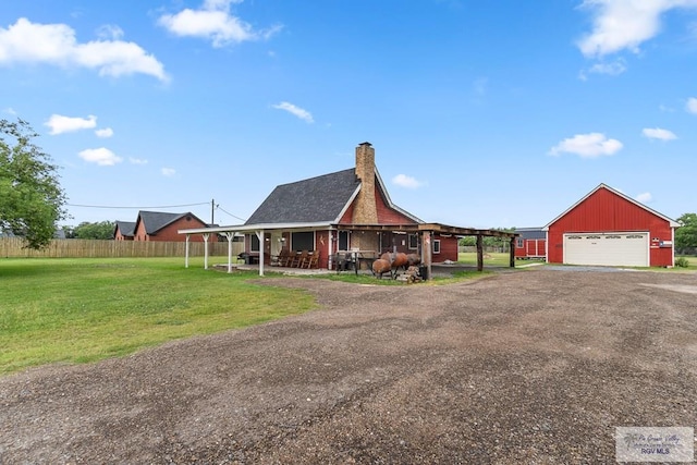 27858 Bixby Rd, La Feria, TX 78559 - country-style home with a garage, an outdoor structure, and a chimney