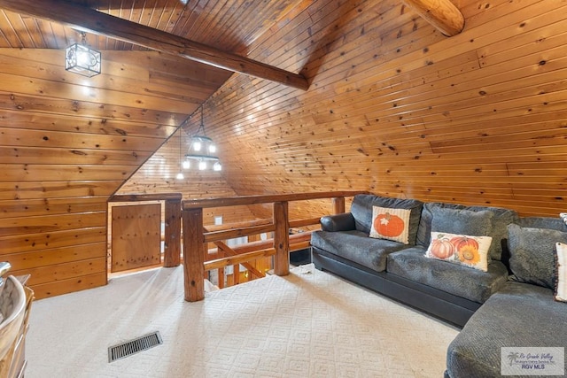 27858 Bixby Rd, La Feria, TX 78559 - living area featuring wooden ceiling, wood walls, and carpet floors
