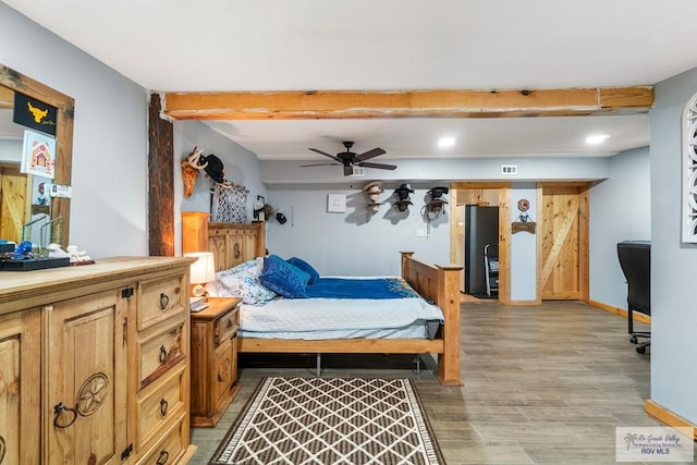 27858 Bixby Rd, La Feria, TX 78559 - bedroom featuring light wood-type flooring, beam ceiling, and baseboards