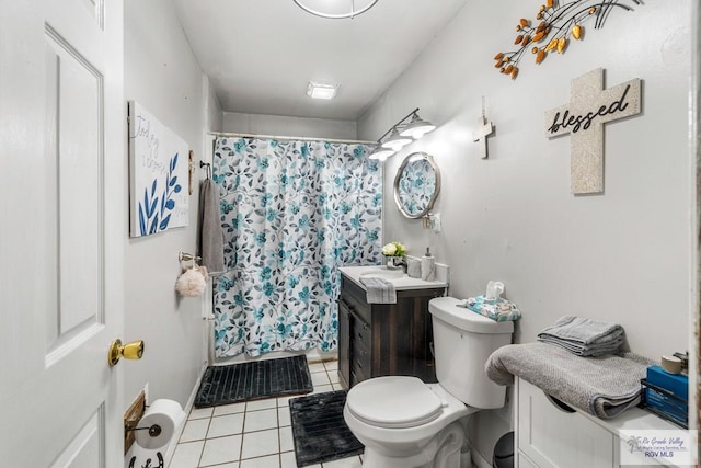 27858 Bixby Rd, La Feria, TX 78559 - full bath featuring vanity, tile patterned flooring, toilet, and curtained shower