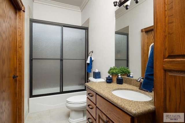 full bathroom with tile patterned flooring, crown molding, toilet, shower / bath combination with glass door, and vanity