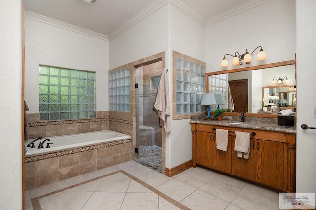 bathroom with tile patterned floors, vanity, independent shower and bath, and ornamental molding