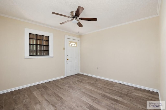 unfurnished room with crown molding, hardwood / wood-style floors, ceiling fan, and a textured ceiling