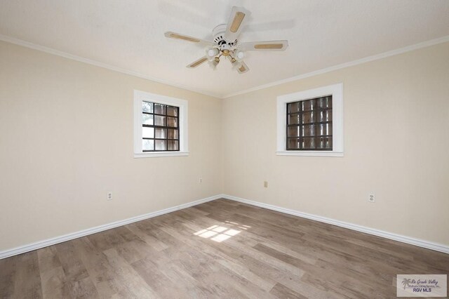 spare room with hardwood / wood-style flooring, ceiling fan, and ornamental molding