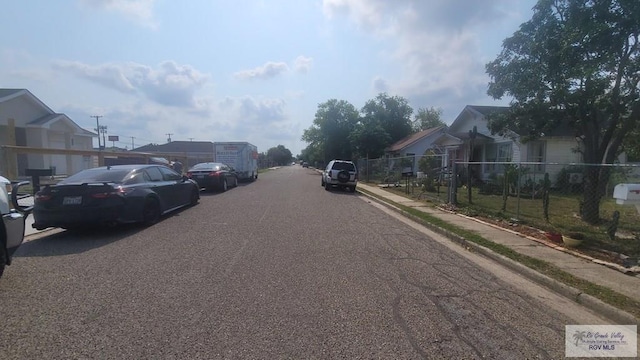 909 W Hanson St, Harlingen, TX 78550 - view of asphalt street with sidewalks, curbs, and a residential view