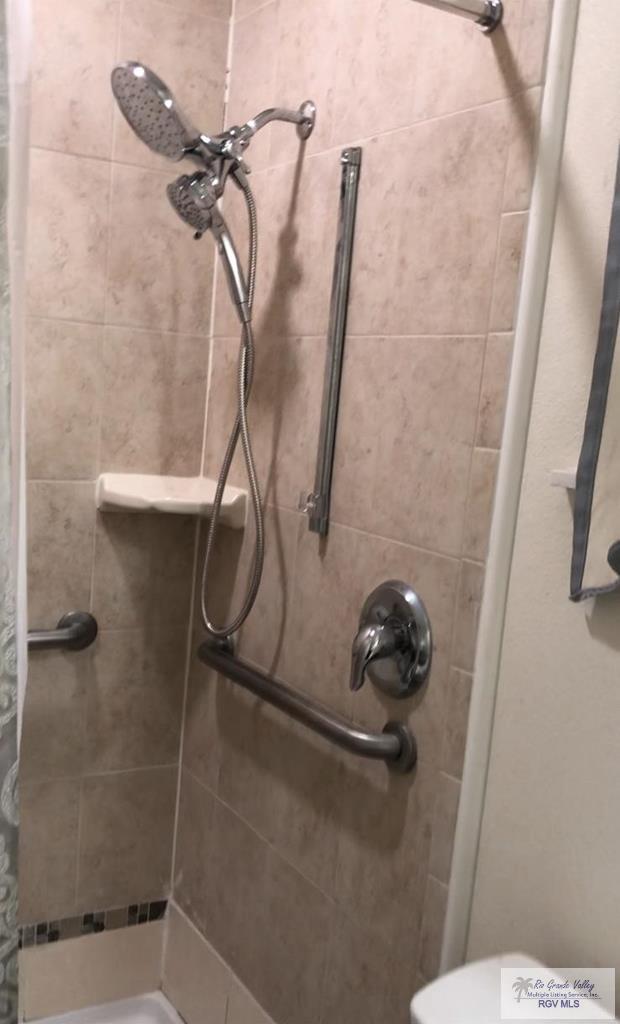 bathroom with a shower with curtain