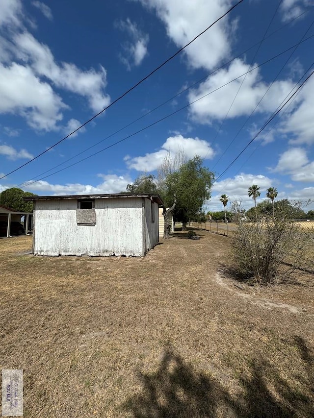 25631 N White Ranch Rd, La Feria, TX 78559 - view of home's exterior featuring a lawn