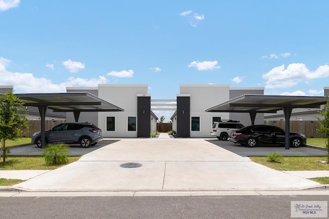 1105 W La Pointe Ave, Alton, TX 78573 - view of front of home featuring covered parking and stucco siding