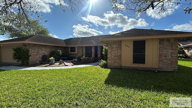 back of house with a yard