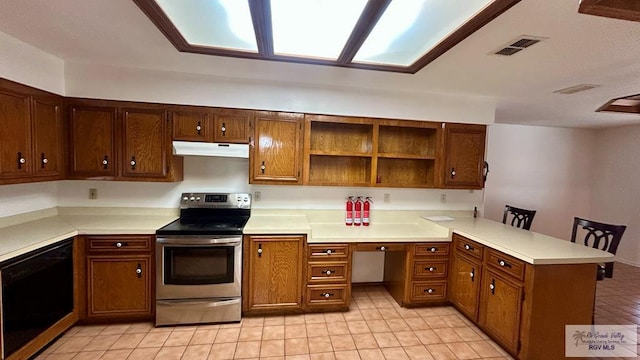 kitchen with dishwasher, light tile patterned flooring, stainless steel electric range oven, and kitchen peninsula