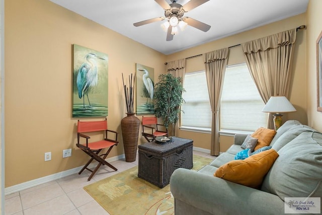 129 E Cora Lee Dr Unit 205, South Padre Island, TX 78597 - living room featuring light tile patterned floors, ceiling fan, and baseboards