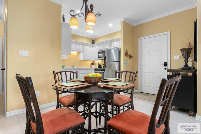 129 E Cora Lee Dr Unit 205, South Padre Island, TX 78597 - dining area with light tile patterned floors, visible vents, baseboards, an inviting chandelier, and ornamental molding