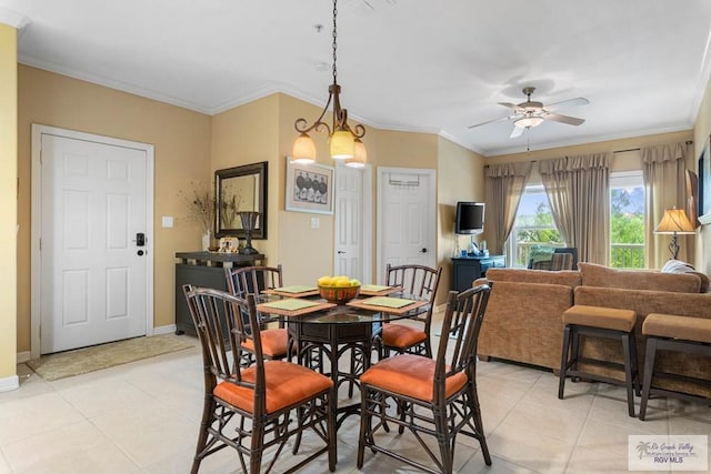 129 E Cora Lee Dr Unit 205, South Padre Island, TX 78597 - dining area featuring a ceiling fan, light tile patterned flooring, and crown molding