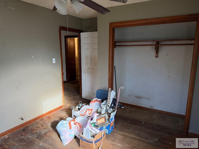 bedroom featuring a closet, ceiling fan, and dark hardwood / wood-style floors