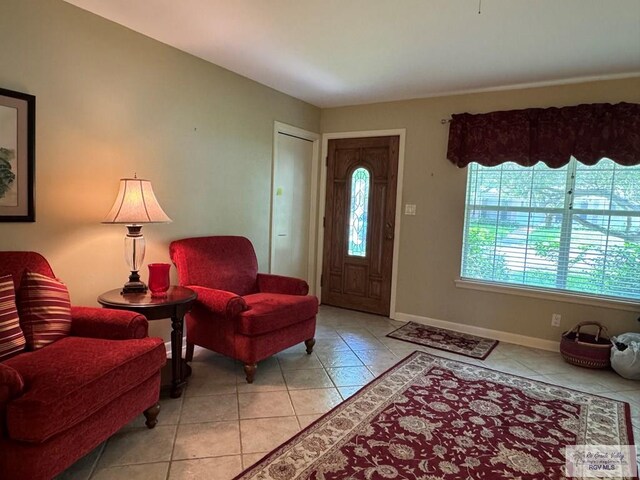 entryway featuring light tile patterned floors and baseboards