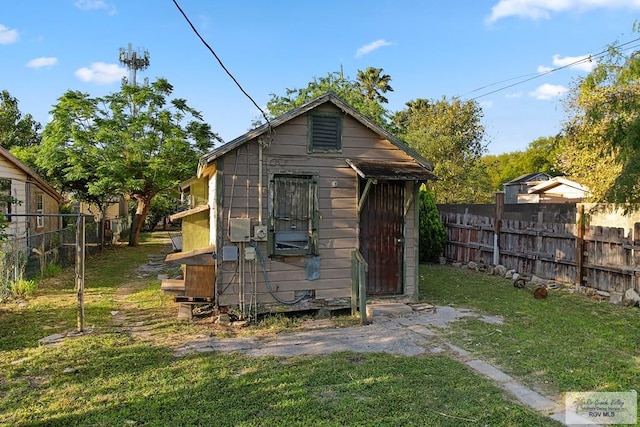 view of shed with fence