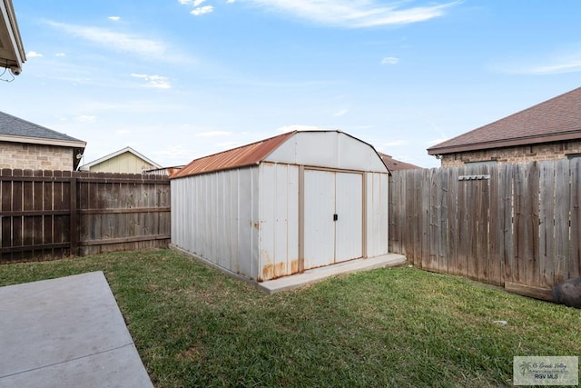 view of outbuilding with a lawn