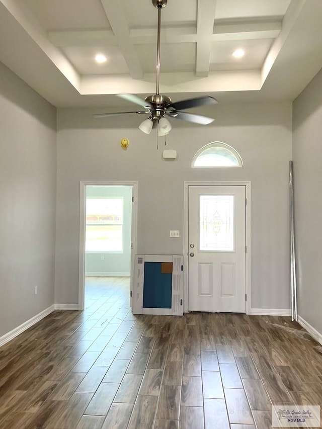 foyer with dark hardwood / wood-style flooring, ceiling fan, a healthy amount of sunlight, and coffered ceiling