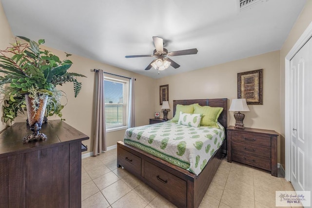 tiled bedroom featuring ceiling fan