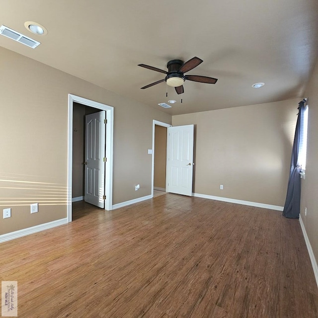 1626 N Shore Dr, Port Isabel, TX 78578 - spare room with wood finished floors, ceiling fan, baseboards, and recessed lighting