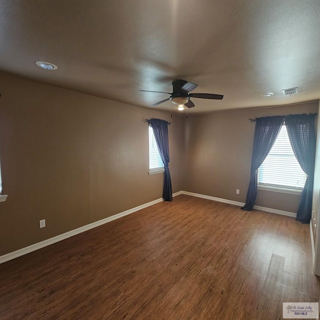 1626 N Shore Dr, Port Isabel, TX 78578 - unfurnished room featuring a ceiling fan, healthy amount of natural light, and wood finished floors