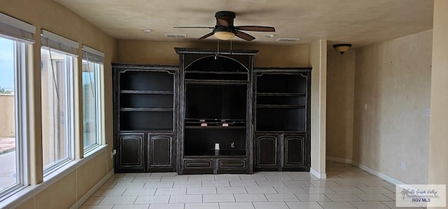 1626 N Shore Dr, Port Isabel, TX 78578 - interior space with a ceiling fan, light tile patterned floors, and baseboards