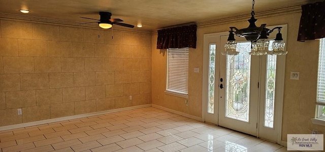 1626 N Shore Dr, Port Isabel, TX 78578 - entryway featuring a chandelier, a ceiling fan, ornamental molding, light tile patterned floors, and baseboards