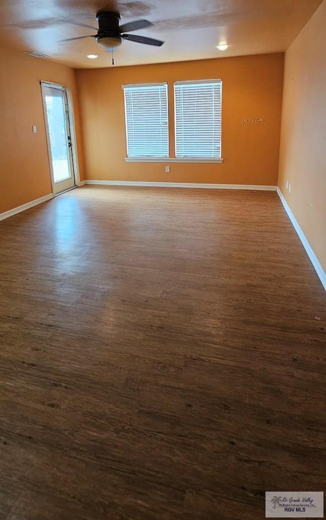 1626 N Shore Dr, Port Isabel, TX 78578 - unfurnished room featuring wood finished floors, a ceiling fan, and baseboards