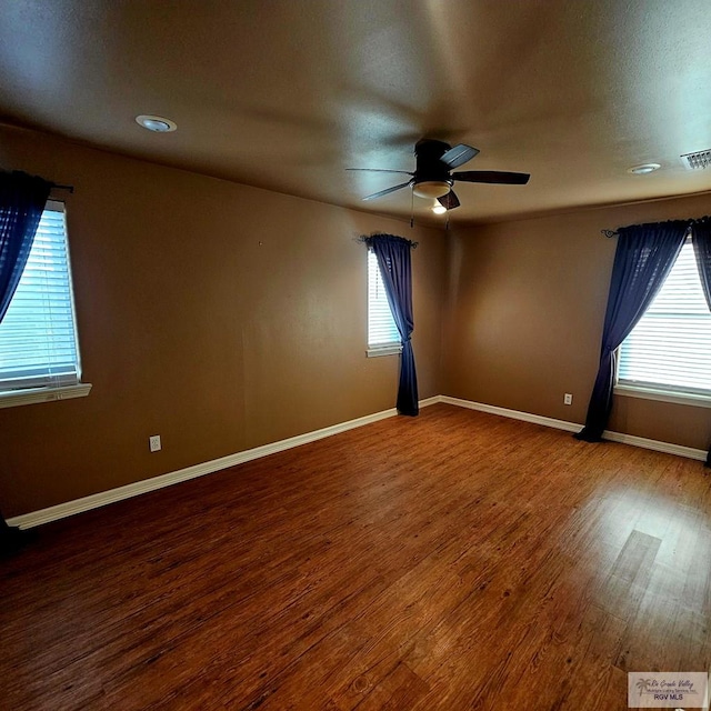 1626 N Shore Dr, Port Isabel, TX 78578 - empty room with ceiling fan, wood finished floors, and baseboards