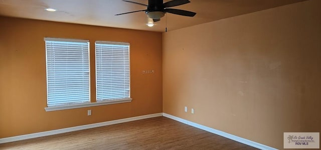 1626 N Shore Dr, Port Isabel, TX 78578 - spare room with a ceiling fan, baseboards, and wood finished floors