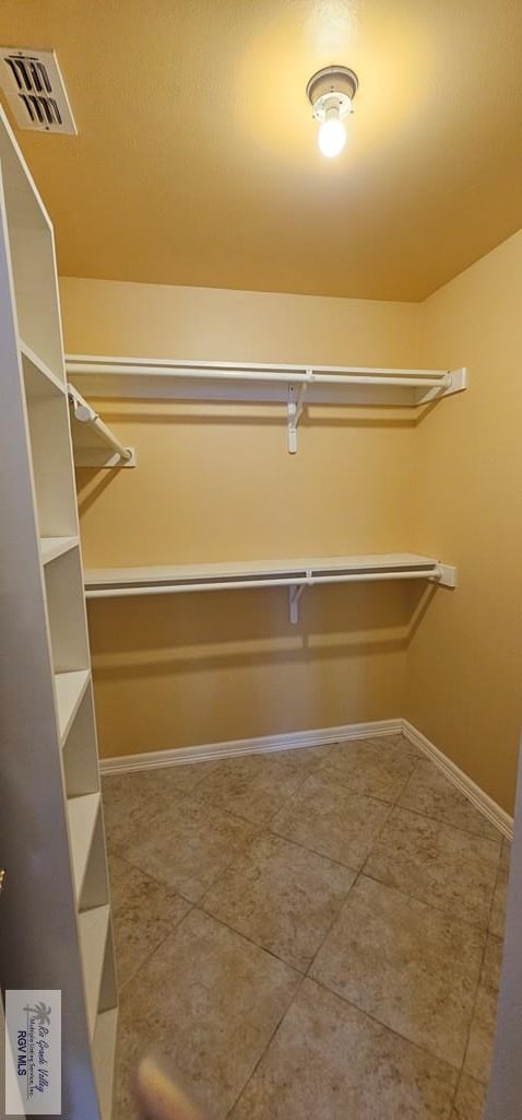 1626 N Shore Dr, Port Isabel, TX 78578 - spacious closet featuring tile patterned flooring